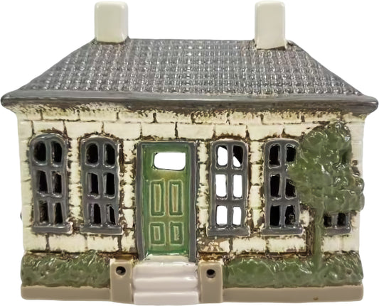 Ceramic Green Garden Cottage tealight holder featuring a green front door, stone cottage design, and decorative garden details